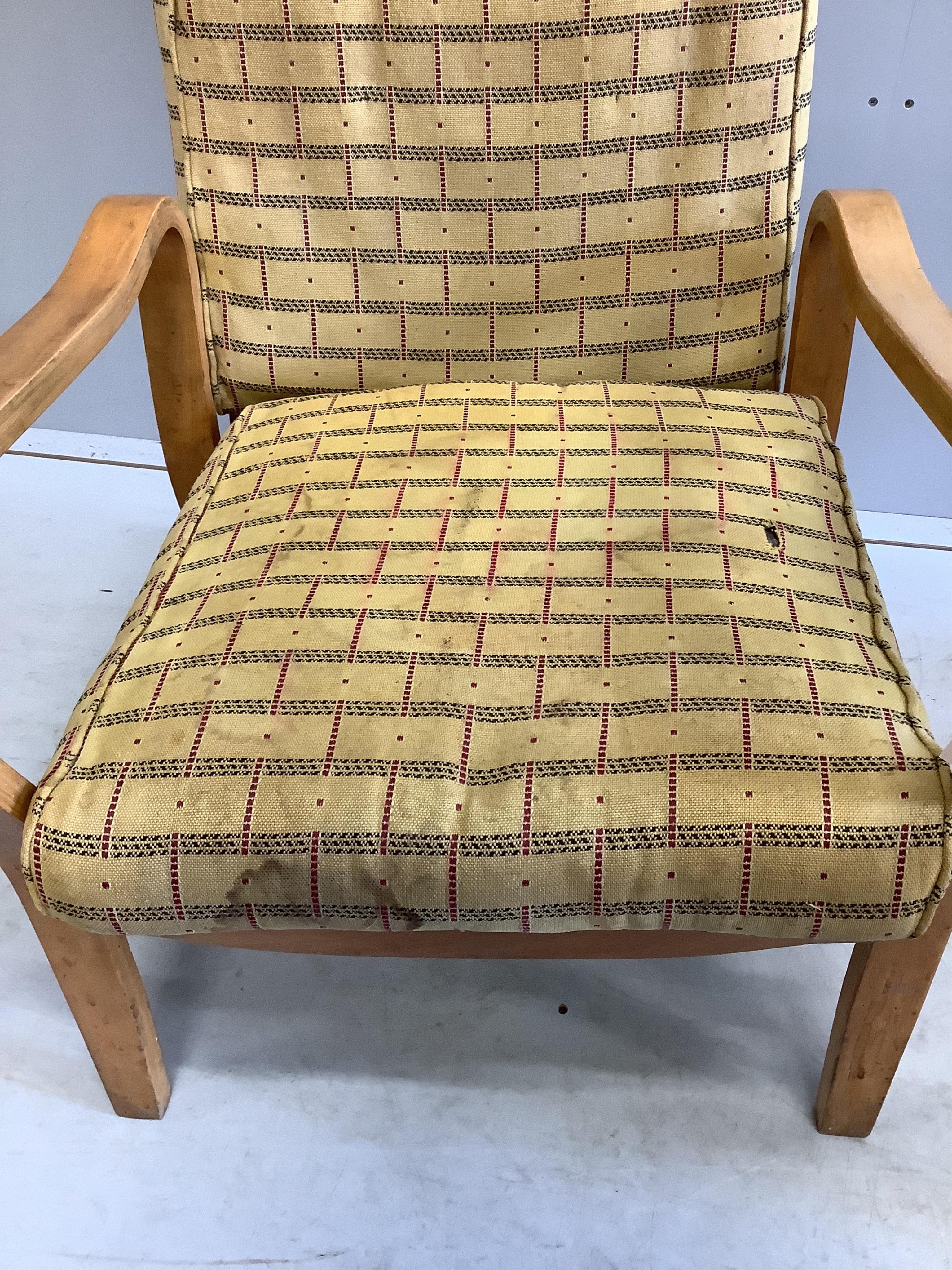 A pair of mid century Eric Lyons Tecta armchairs, width 56cm, depth 54cm, height 85cm. Condition - fair, upholstery poor